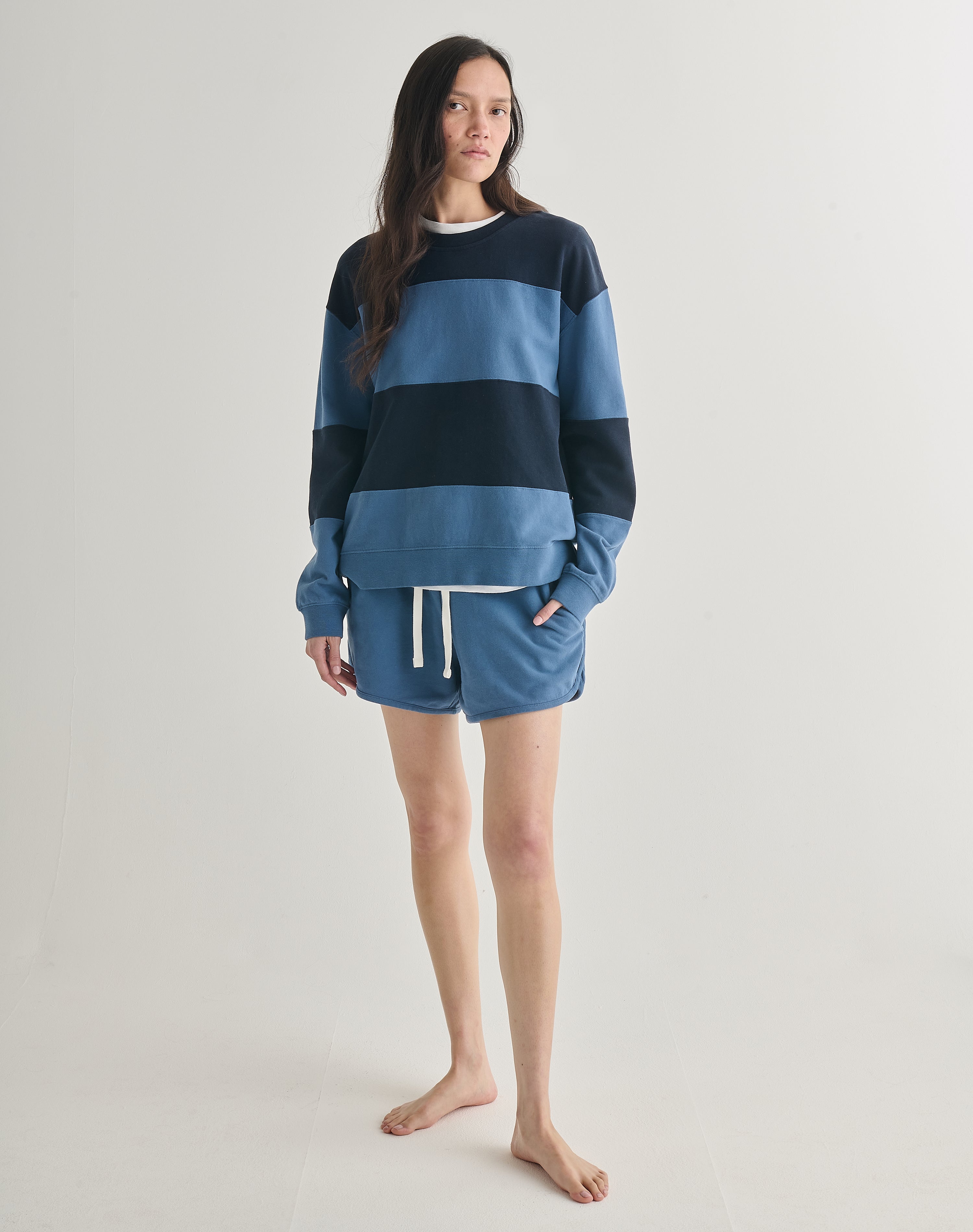 Full body view of the Sunday Suit / The Shortie in Ocean Blue & Navy.